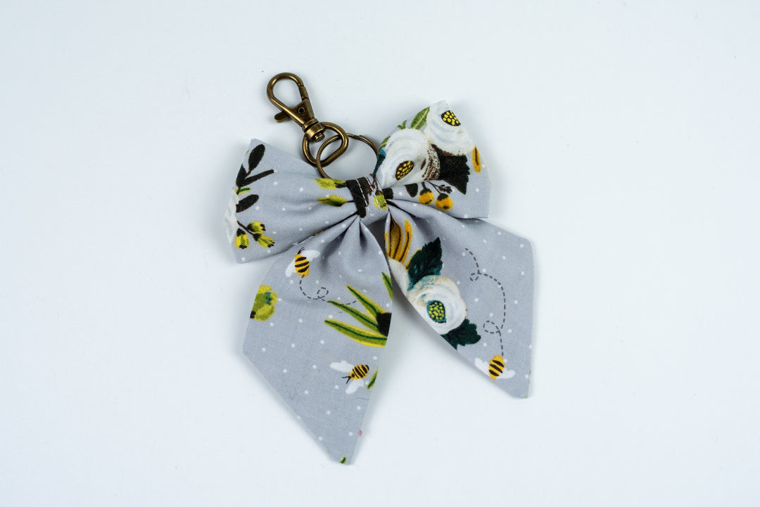 Floral keychain with a bow on a white background