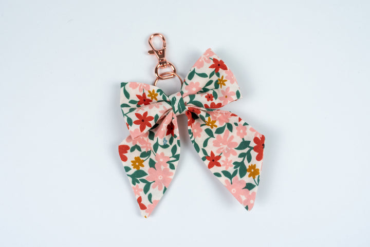 Floral bow keychain on a white background