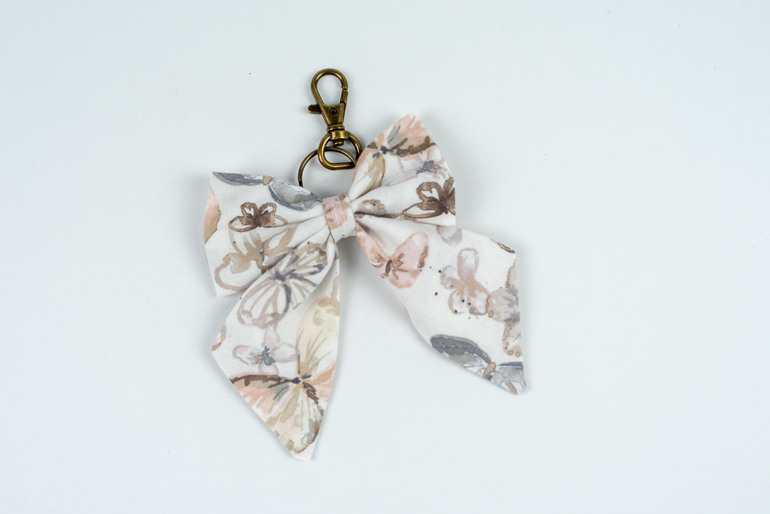 Butterfly keychain bow on a light gray background