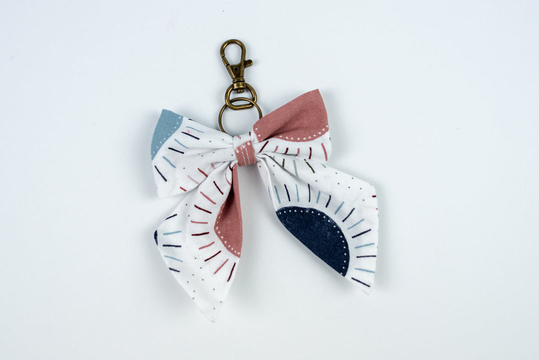 Fabric bow keychain with a keyring on a white  background